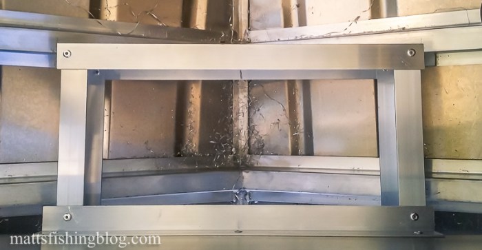 front of rod locker past front seat