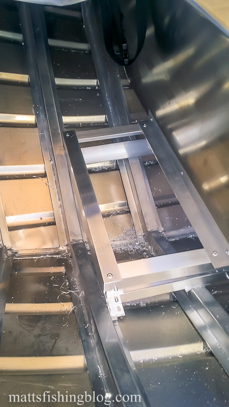 front of rod locker past front seat